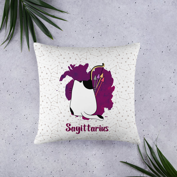 12 siblings Sagittarius zodiac 'Paws' collection pet cushion placed on the floor with two plants around it.